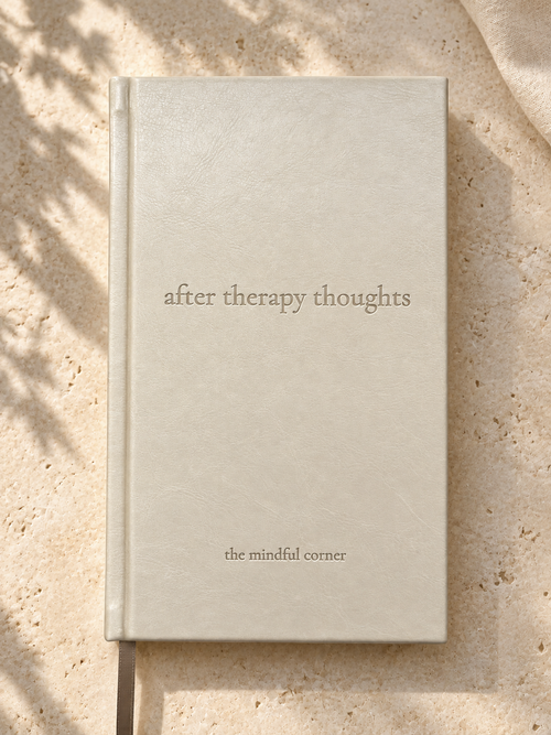 After Therapy Thoughts hardcover journal in cream bonded leather with a debossed title, shown from above