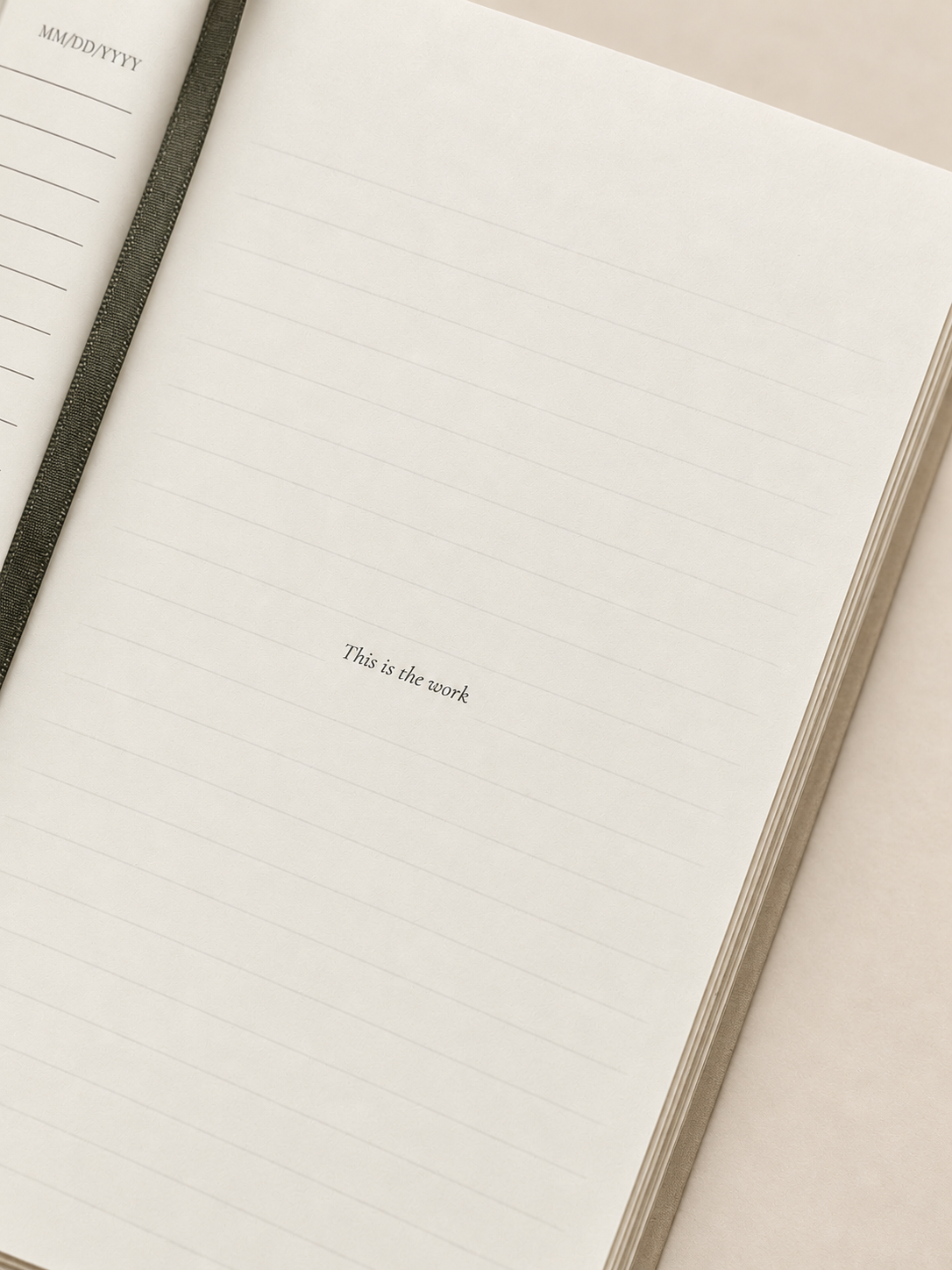 Close-up of a lined page in the After Therapy Thoughts journal with the words This is the work printed in the center