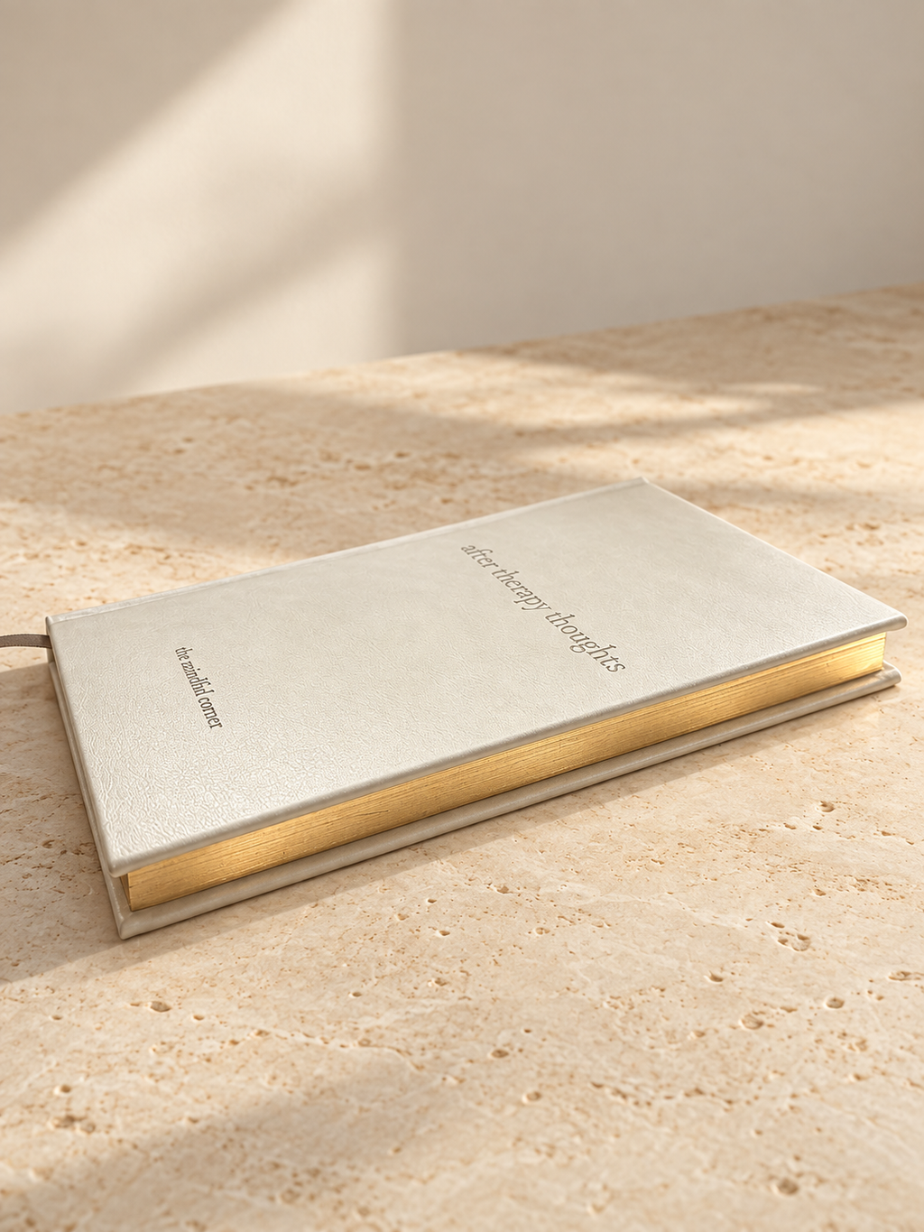 Close-up of the gold gilded page edges of the After Therapy Thoughts journal