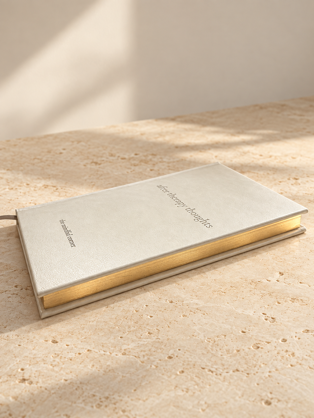 Close-up of the gold gilded page edges of the After Therapy Thoughts journal